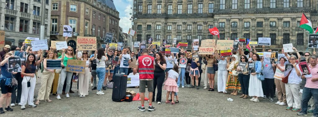 Protesters gather in Amsterdam to call on the government of Turkey to halt their planned dog and cat massacre